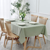 Maxmill textured rectangle tablecloth in sage green enhances dining aesthetics for elegant gatherings.