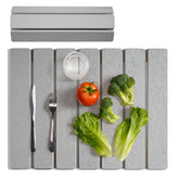 Meowoo Stone Drying Mat on a counter drying dishes quickly