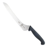 Mercer Millennia bread knife with wavy-edge closeup showing crisp crust cutting.