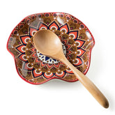 Miamolo spoon rest on stove top keeps utensils organized.
