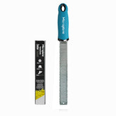 Microplane Premium Classic Turquoise zester teeth capture bright citrus zest for fresh dishes.