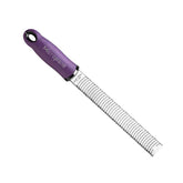 Microplane Premium Classic zester with eggplant purple handle for fresh citrus zest and cheese grating.