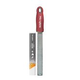 Microplane Premium Classic Zester close-up: pomegranate red handle for citrus zest.