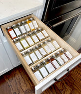 MIUKAA clear acrylic spice drawer organizer with four-tier display for easy access.