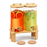 MIWUYI 1.5-gallon glass dispenser on a wooden stand for stylish outdoor parties.