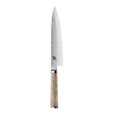 Miyabi Birchwood SG2 8-inch blade close-up shows a sharp edge for precise slicing.