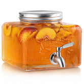 MosJos glass drink dispenser with spigot for spill-free serving at parties.