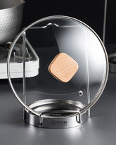 Mukkuri pot lid organizer stand displaying lids and utensils on a counter for easy access