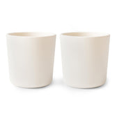 Mushie ivory dinnerware cups for kids, set of two, easy to grip during meals.