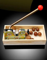 MxTong manual nutcracker in action cracking nuts effortlessly with minimal effort.