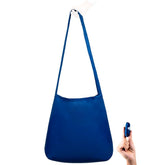 Nanobag ultra-lightweight sling in navy folds to pocket size for easy carry.