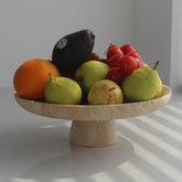 Nawgnail natural travertine fruit bowl on counter for fresh fruit display
