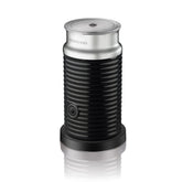 Nespresso Aeroccino 3 side view shows sleek stainless steel and compact design for easy countertop use.