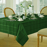 Newbridge Elegance Plaid tablecloth in hunter green with a refined, stain-friendly finish.