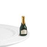 Nora Fleming champagne bottle mini with a hand-painted finish for elegant table decor.