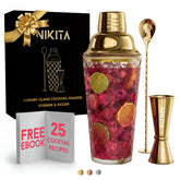 Nikita By Niki glass cocktail shaker set in gold finish for stylish home entertaining.