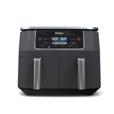 Ninja DZ201 dual-zone baskets show two independent compartments for two foods at once.