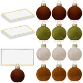 Ninitial velvet glass card-ball holder on table adds festive organization.