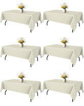 Niuara Ivory tablecloth on a 5ft rectangle table showing smooth drape