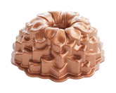 Nordic Ware Blossom Bundt Pan close-up highlights intricate petal details for stunning desserts.