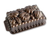 Nordic Ware Harvest Bounty Loaf Pan side view highlights durable cast aluminum for even browning.