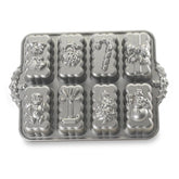 Nordic Ware Holiday Mini Loaves Pan with bell design for festive gifts.