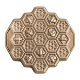 Nordic Ware honeycomb pull-apart pan top view shows 10-cup capacity for precise cakelets and even browning.