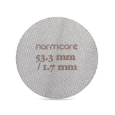 Normcore puck screen fitted to a 54mm portafilter for secure, even extraction