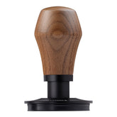 Normcore tamper closeup with titanium PVD base for durable, even tamping