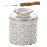 Nucookery butter crock with lid shows embossed petal pattern on ceramic counter.