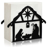 Nuogo nativity metal napkin holder on tabletop adds festive table decor.