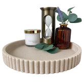 OAKOA decorative tray with fluted edge serves as a stylish round centerpiece for the living room.