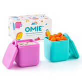 OmieBox dip containers in pink and teal offer leakproof sauce storage on the go.