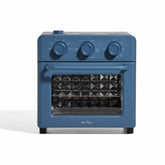 Our Place Wonder Oven front view showing compact 13 qt countertop design and blue-salt finish