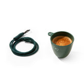 OutIn espresso cup clipped on a bag for on-the-go coffee.