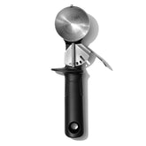 OXO Good Grips Classic Swipe ice cream scoop in action releasing a rounded scoop.
