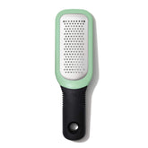 OXO Good Grips etched grater close-up shows sharp teeth for garlic and ginger paste.