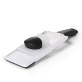 OXO Good Grips Mandoline Slicer set to 1mm for precise vegetable slices on plates