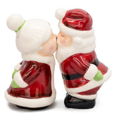 Pacific Giftware Santa and Mrs. Claus kissing salt and pepper shakers add festive table charm.