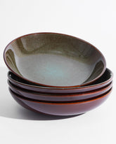 Pokini 8.75-inch ceramic bowl with reactive glaze brightens table presentations.