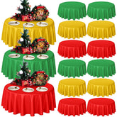 Preboun round table cover in red-green-gold shields surfaces during festive dining.