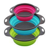 QiMH collapsible green colander folded for space-saving storage.