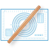 QUELLANCE wood French rolling pin on silicone mat for smooth dough rolling.
