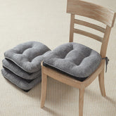 Quilmfoam dining chair cushions in assembly setup for enhanced comfort.