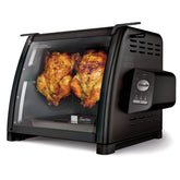 Ronco Modern Rotisserie Oven roasting a full turkey for even browning.