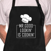 Rosoz Mr Goodlookin BBQ apron on model showing playful design for gifts and cooking