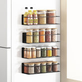 Roysili magnetic spice rack on fridge door organizing jars within easy reach.