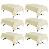 Sancua beige tablecloth on a 60x102 inch dining table with a clean, elegant look.