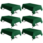 Sancua hunter green tablecloth 60x102 inches on a dining table, protects surfaces.