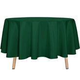 Sancua round tablecloth 90-inch hunter green on dining table protecting surface from spills